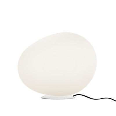 Świecąca lampa ogrodowa Gregg Outdoor Foscarini między roślinami